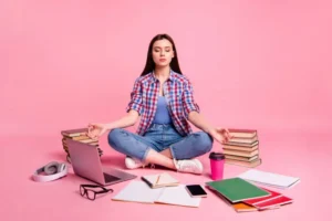 A student studying with books and notessymbolizing effective preparation strategies for the CUET 2025 exam.